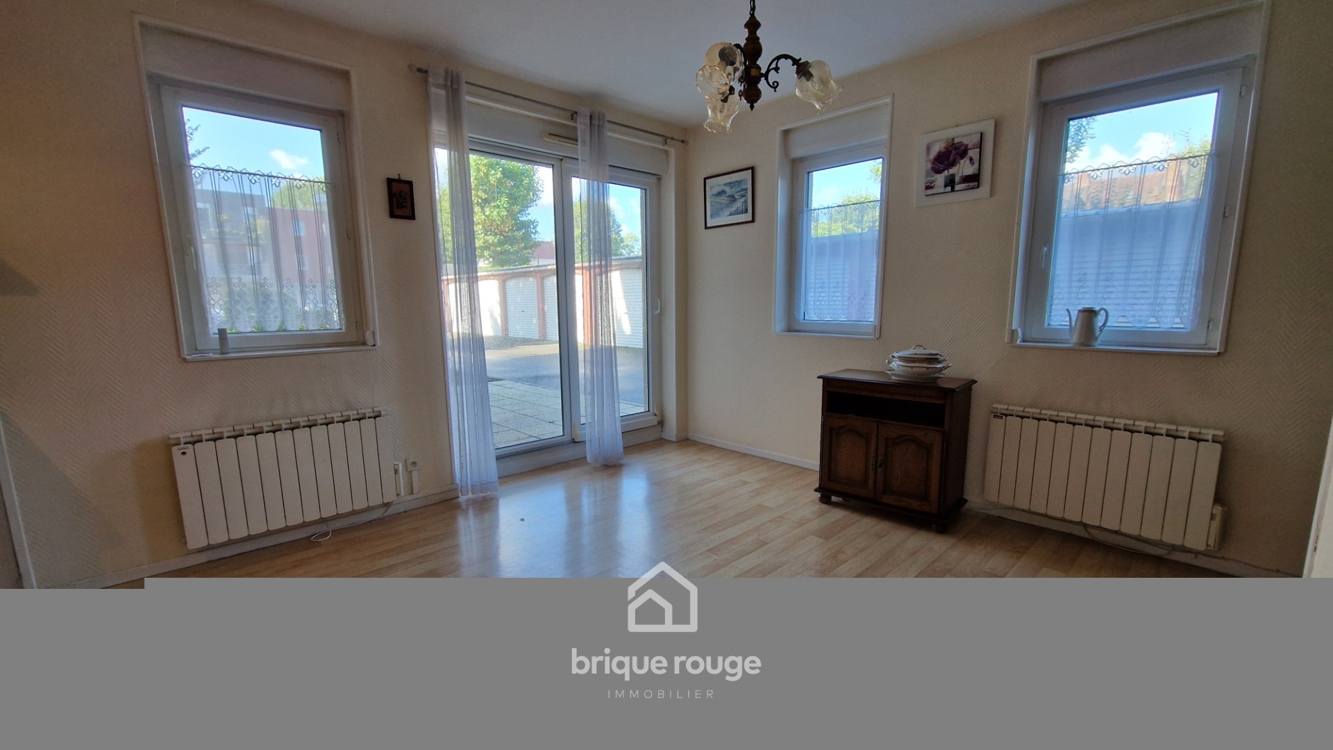 Appartement 2 chambres avec terrasse et 2 places de parking Photo 1 - Brique Rouge Immobilier