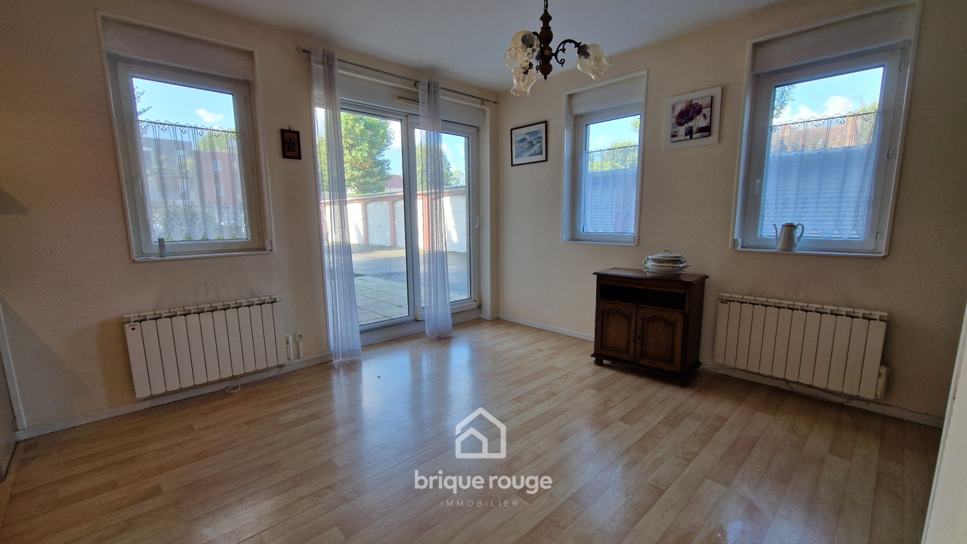 Appartement 2 chambres avec terrasse et 2 places de parking Photo 2 - Brique Rouge Immobilier