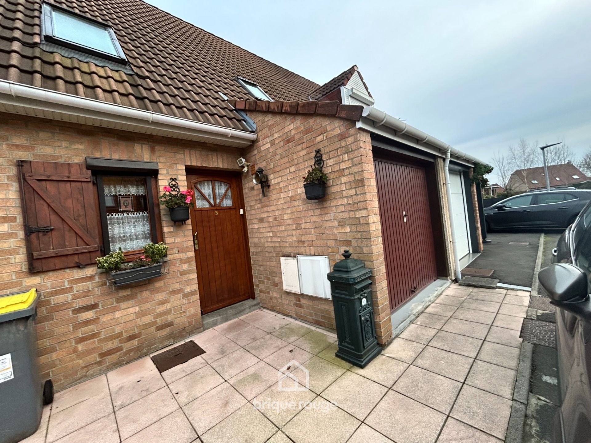 Belle maison de lotissement avec jardin et garage Photo 1 - Brique Rouge Immobilier